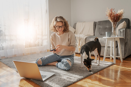 Happy young woman with dog, a Person Photo by Olezzo