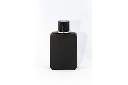 Black Matte Bottle of Perfume for, a Background Photo by InfinitumProdux
