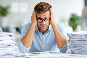 Stressed office worker holding head, a Business Photo by MistyDay
