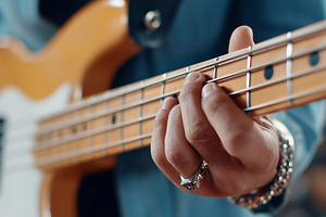 Close up on a musician's hand play, an Arts & Entertainment Photo by MistyDay