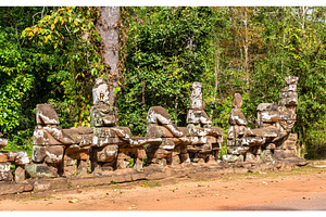 Guardians at Victory Gate Bridge of Angkor Thom - Siem Reap, Cambodia, an Architecture Photo by Leonid Andronov