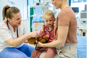 Little boy trying pediatrician's, a Health & Medical Photo by HalfPoint