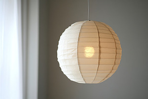 Chinese paper lantern on grey background, a Photo by AlyaAnd
