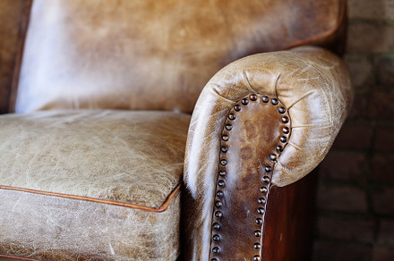 Closeup texture of leather sofa featuring antique, armchair, and back