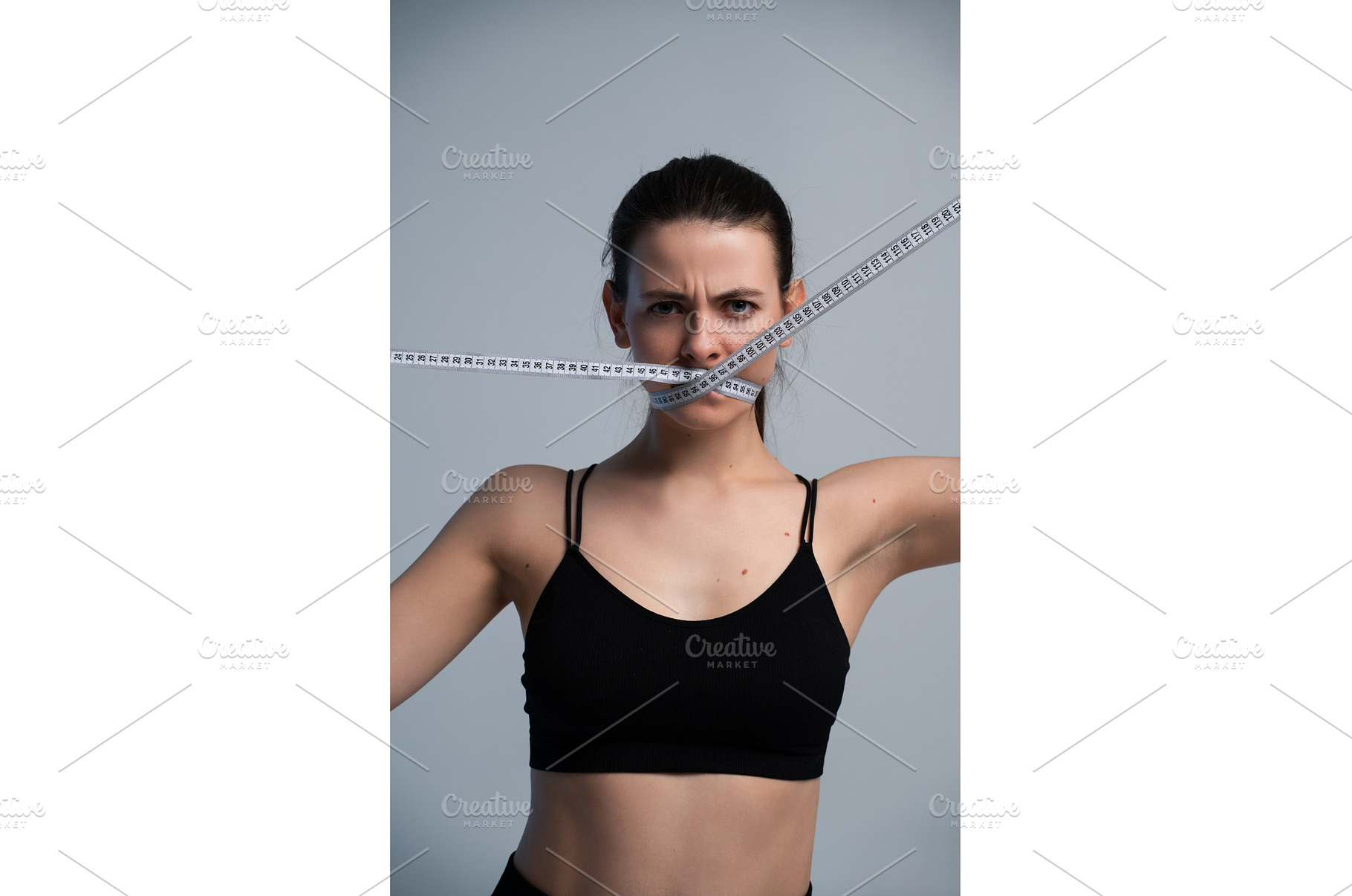 Young woman with measuring tape over, a Sports & Recreation Photo by volodymyrshtun13795