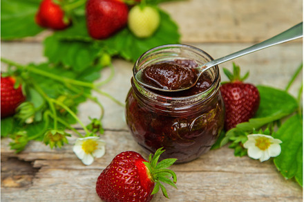 Homemade strawberry jam in a jar, a Food & Drink Photo by yanadjana