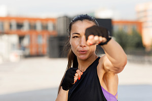 Young female practicing punches, a Sports & Recreation Photo by Artem Varnitsin