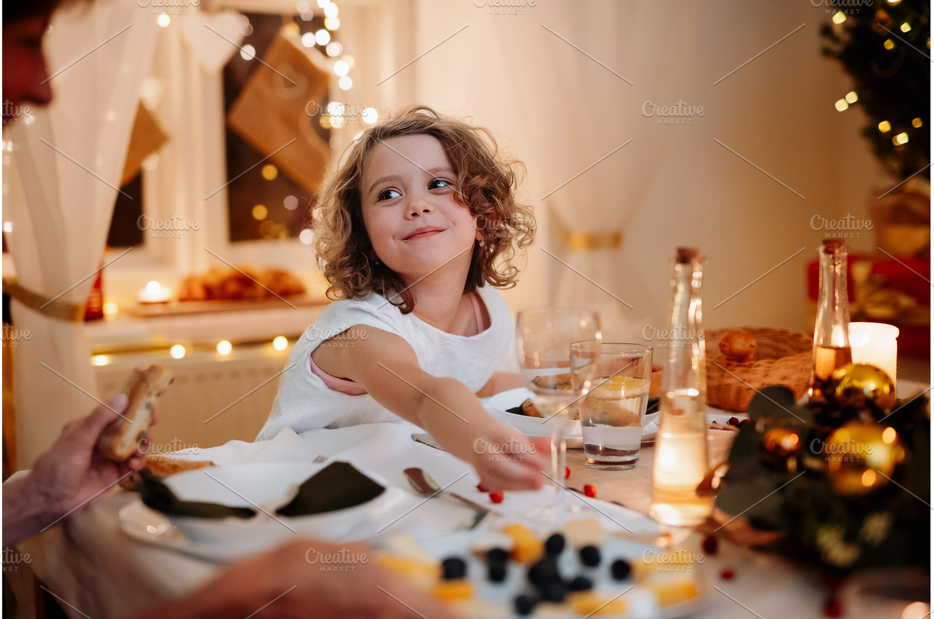 Cheerful small girl during Christmas, a Person Photo by HalfPoint