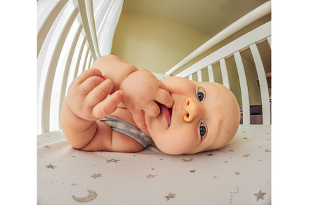 A playful baby in the crib, a Person Photo by Elizaveta Galitskaya