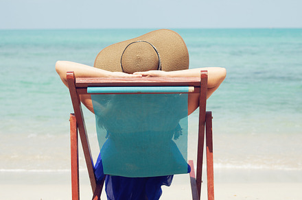 Woman relaxing on a tropical beach featuring woman, beach, and water