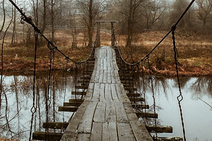 Old wooden bridge overpass, a Nature Photo by Photo by YuraYaryna