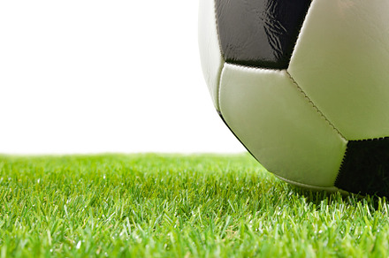 Macro of soccer ball on grass and white isolated background, a Sports & Recreation Photo by Davizro's Market
