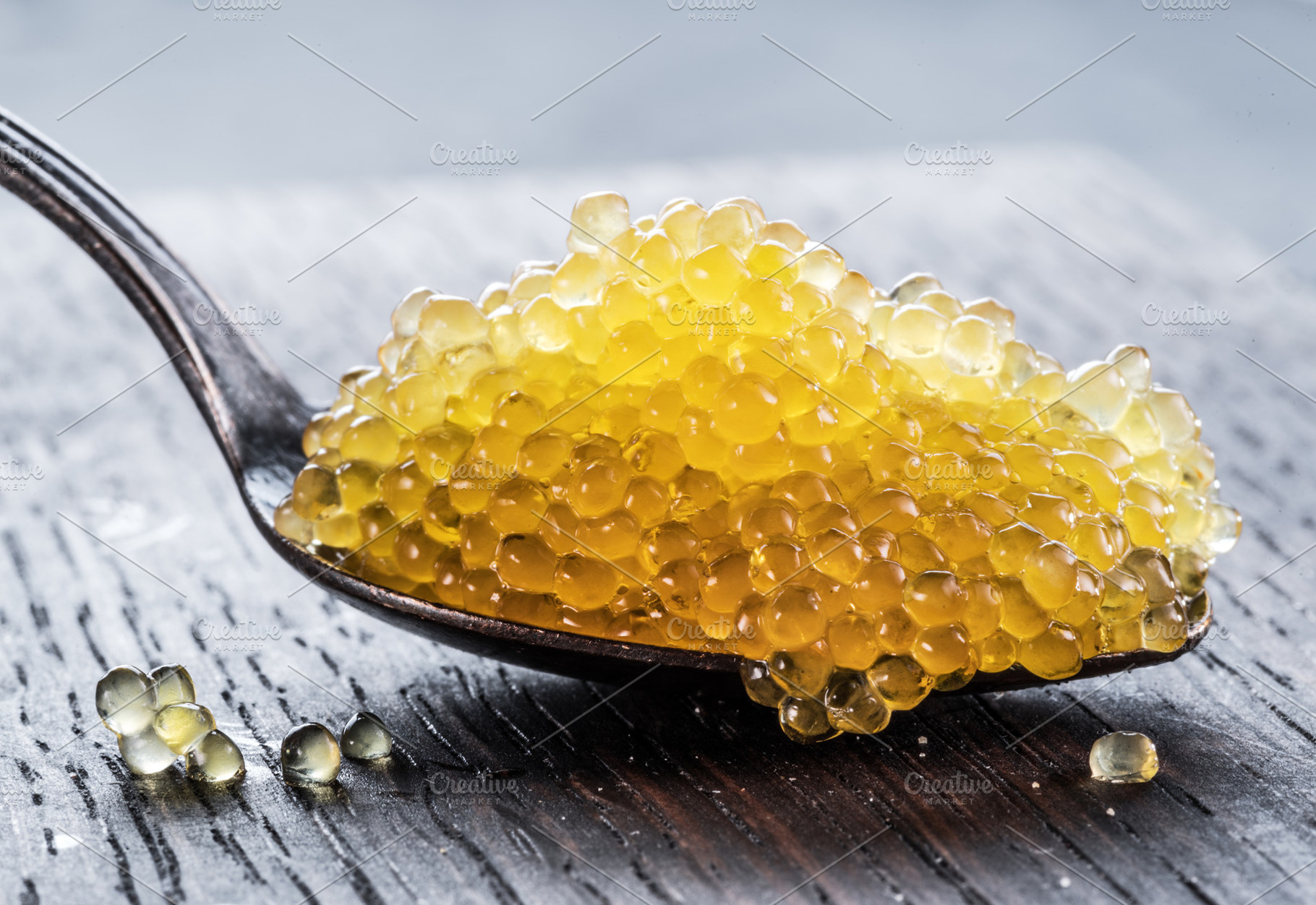 Pike caviar or roe in spoon on woode, a Food & Drink Photo by Volff