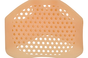 A beige silicone shoe liner on an isolated background featuring, a Health & Medical Photo by ndanko