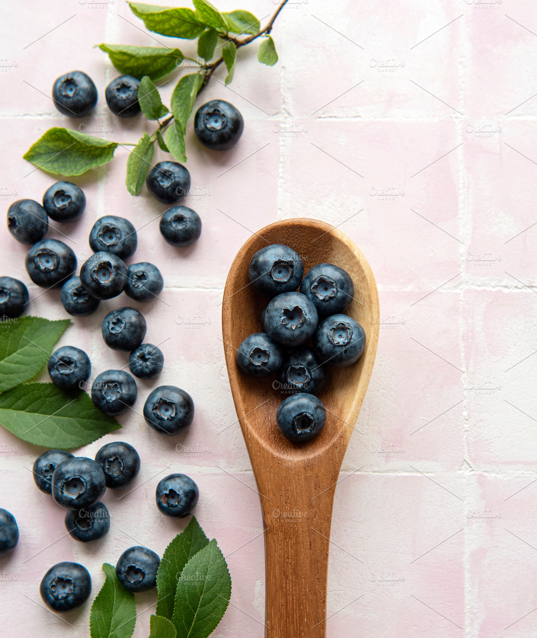 Blueberries on tile background, a Food & Drink Photo by Olena Rudo
