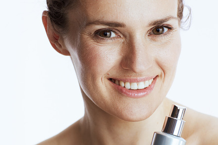 happy modern woman with cosmetic cream jar, a Beauty & Fashion Photo by Alliance Images