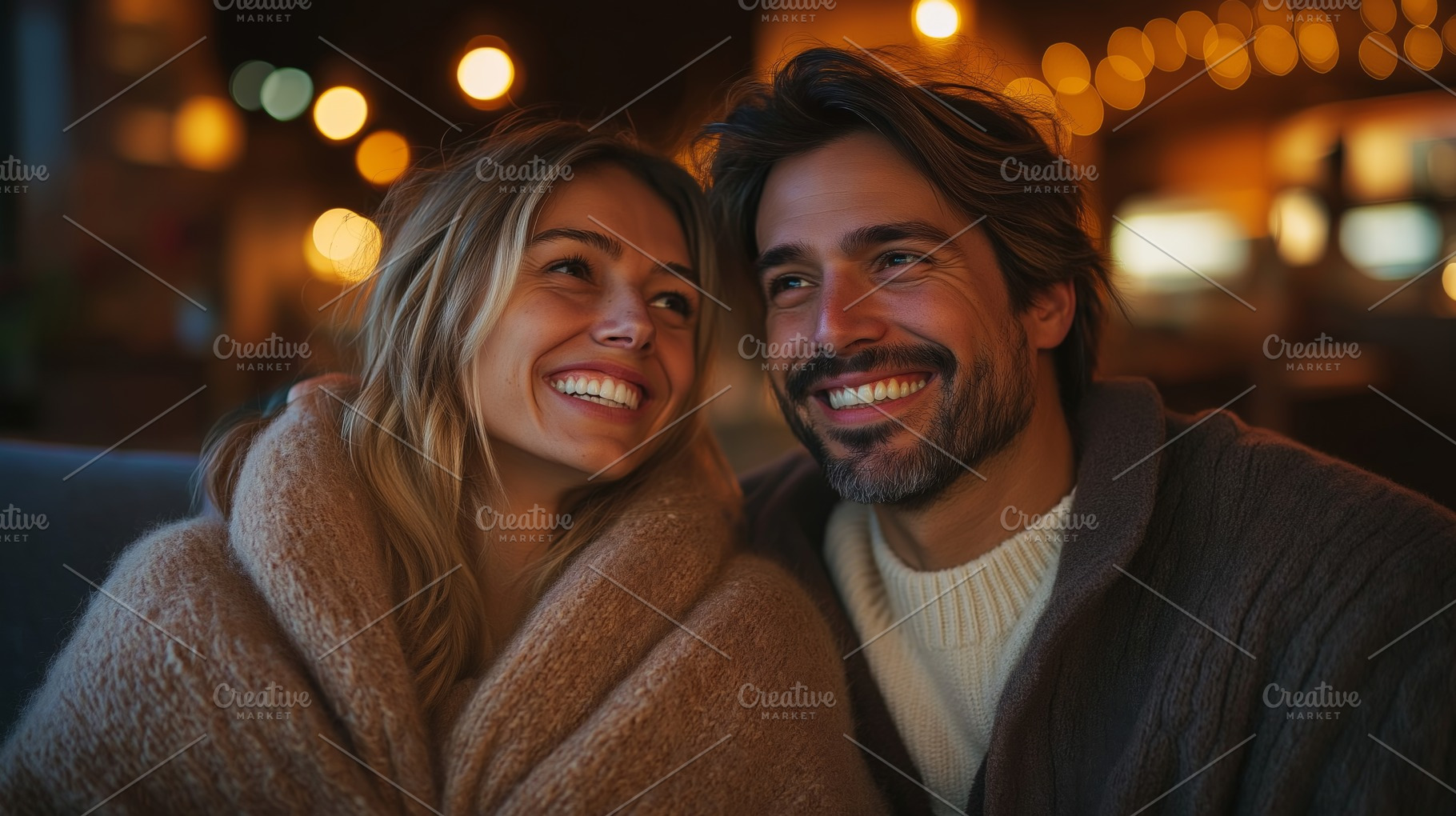 A joyful couple smiles warmly at each other, wrapped in cozy blankets, creating, a Person Photo by ImageMir