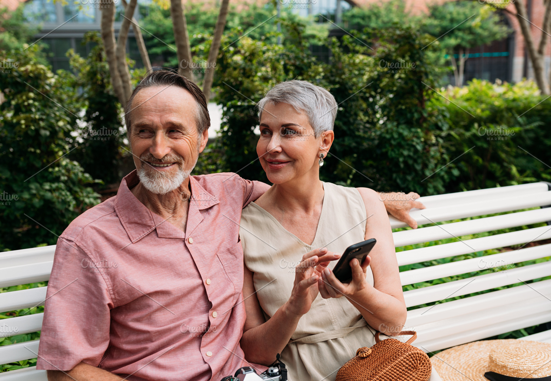 Smiling retired couple sitting, a Person Photo by Artem Varnitsin