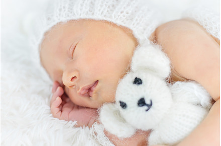 Newborn baby sleeps in a hat, a Beauty & Fashion Photo by yanadjana
