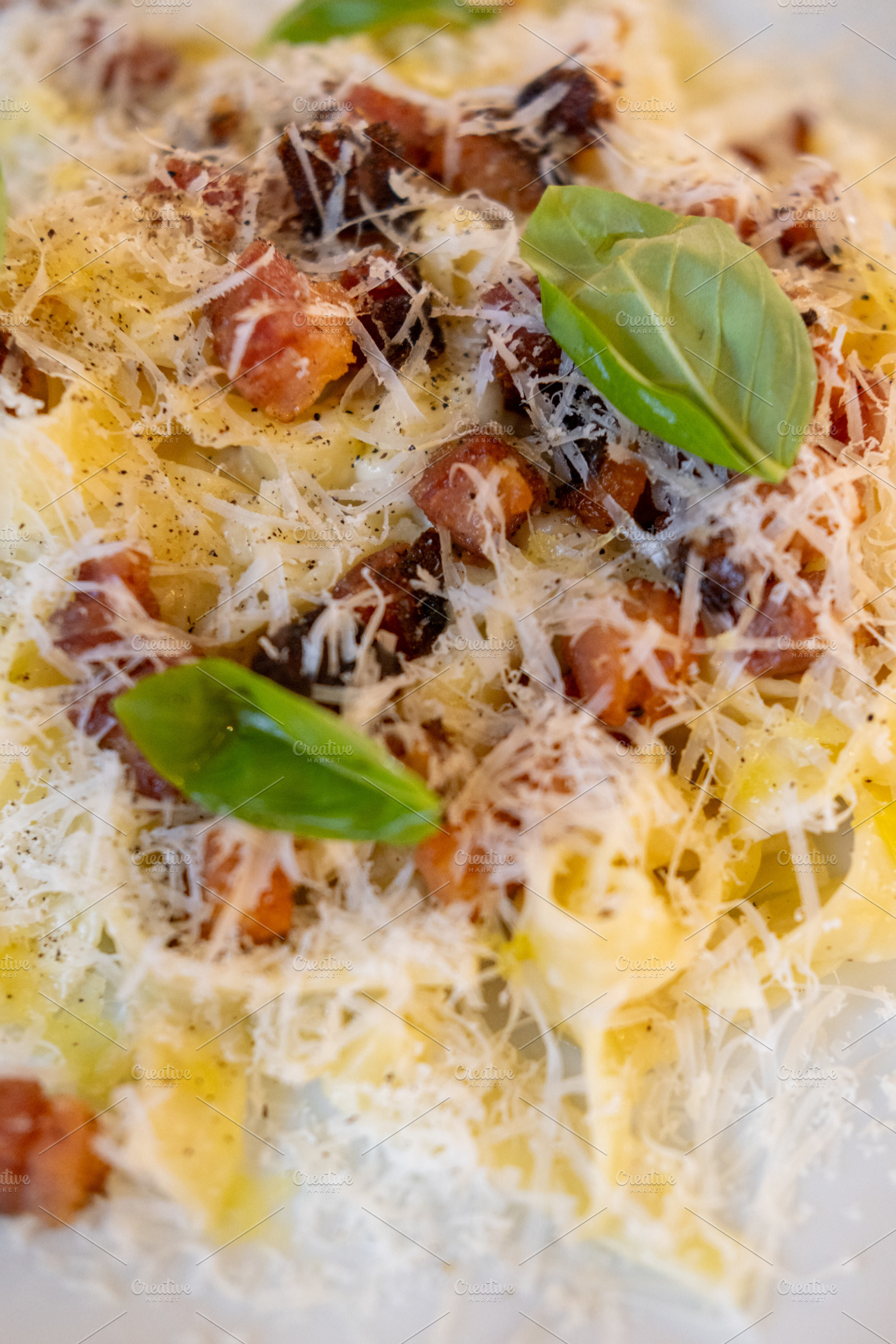 Pasta carbonara italian cuisine bacon cheese basil, a Food & Drink Photo by Photo Drive Studio