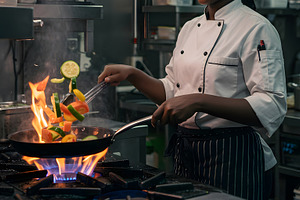 Chef Tossing Vegetables in a Frying, a Food & Drink Photo by Stock Shape