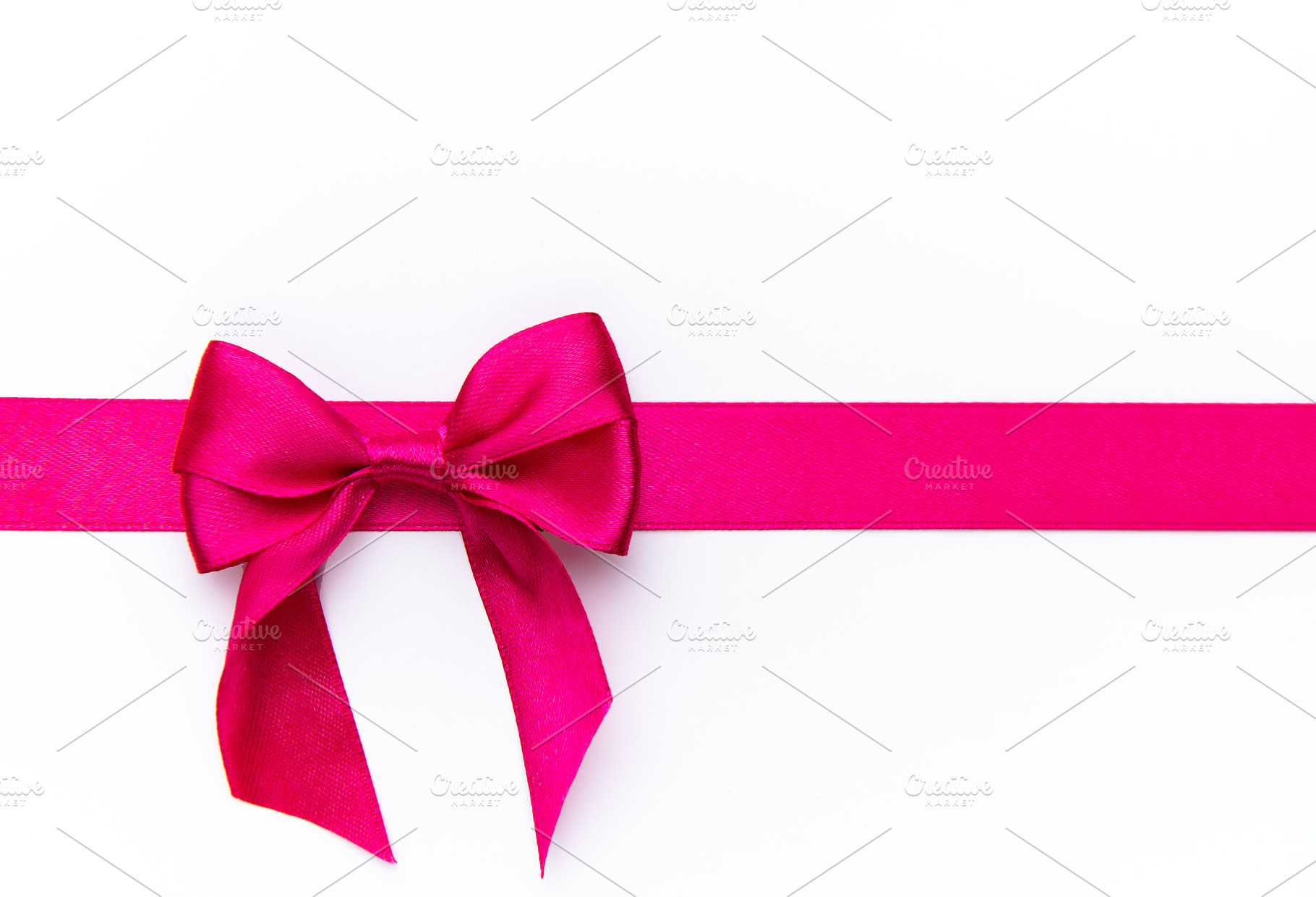 Pink satin ribbon bow gift wrapping decoration, a Photo by Olena Rudo