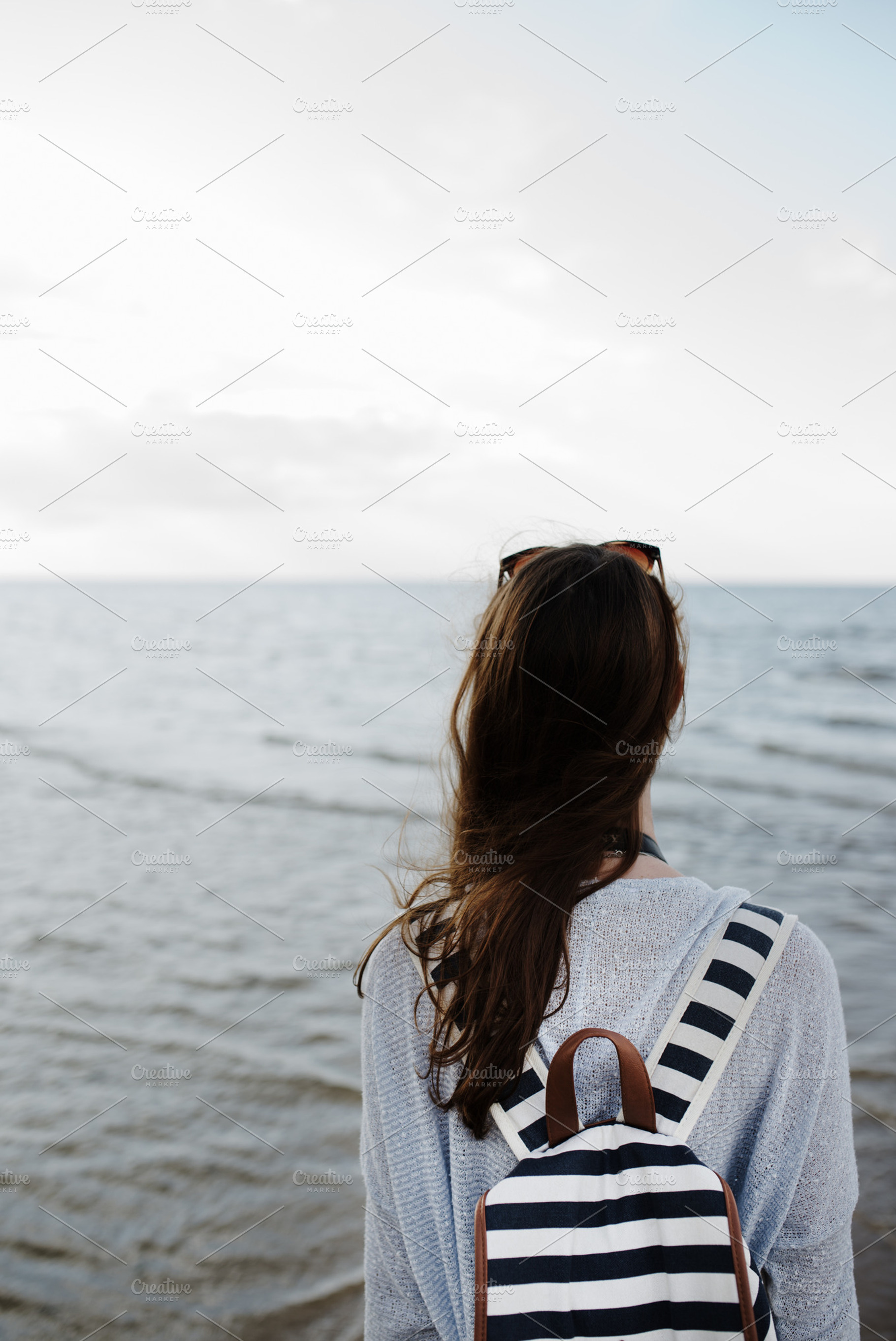 Woman looking at sea containing woman, sea, and adventure, a Person Photo by D&N imagery
