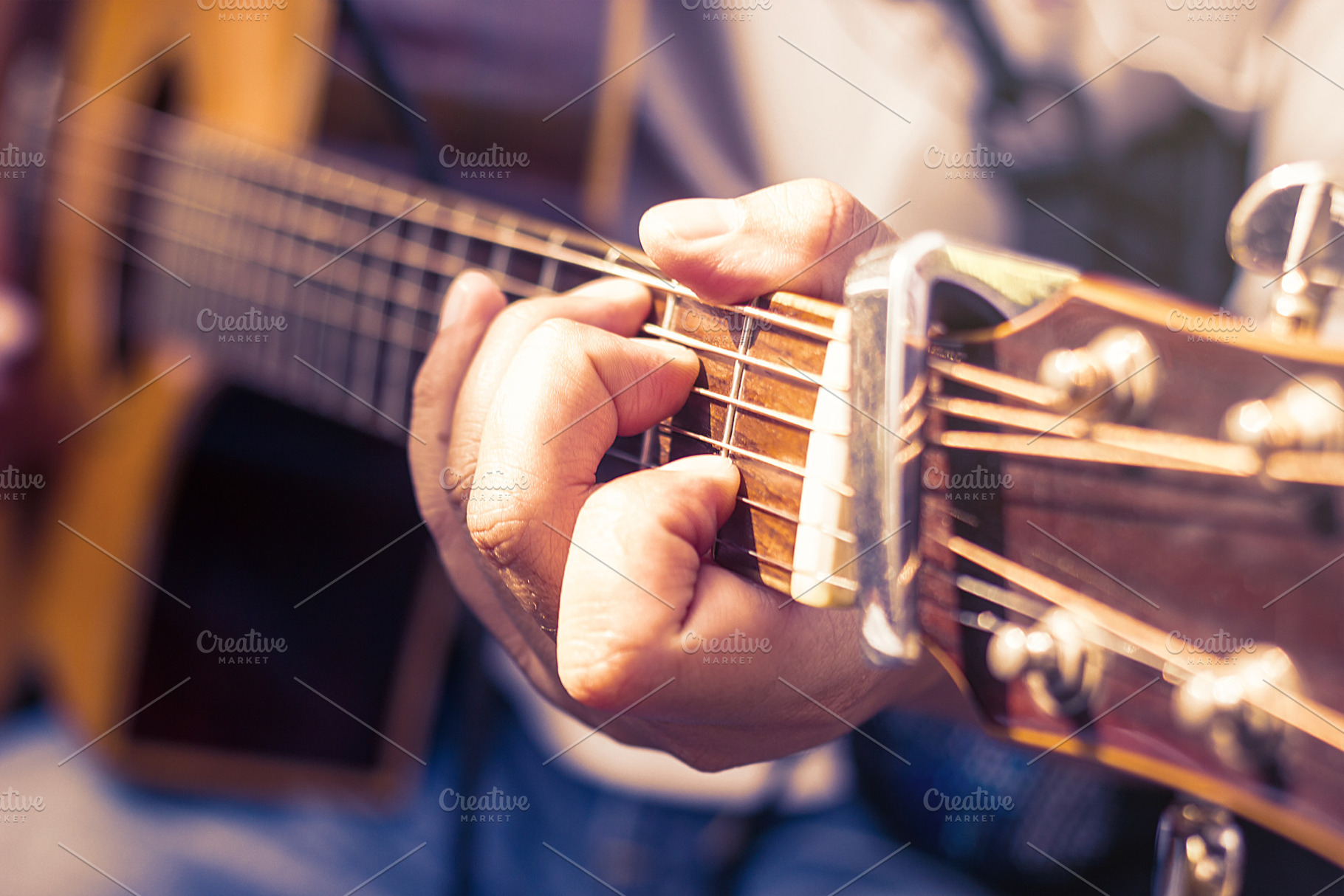 Man's hands playing acoustic guitar containing guitar, player, and music, a School & Education Photo by rakoptonLPN