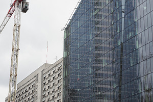 Steel and glass skyscraper and block of flats in Warsaw, a Photo by WorldOfPhotos