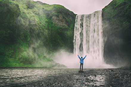 Man near waterfall containing iceland, nature, and water, a Nature Photo by Nature and travel
