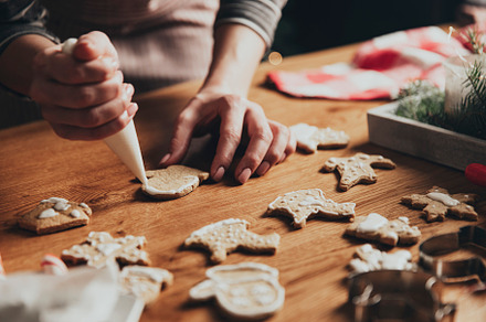 Christmas, New Year food preparation. Gingerbread cookies decorating with icing, a Holiday Photo by Lenor4ik