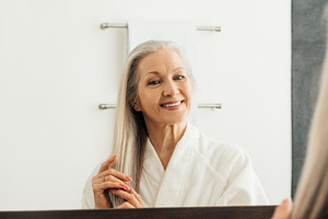 Cheerful senior woman with grey hair, a Person Photo by Artem Varnitsin