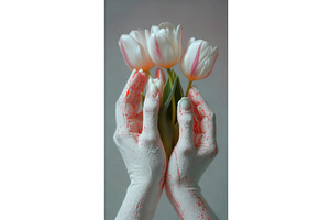 Close-up of white hands with red, an Illustration by tilialucida