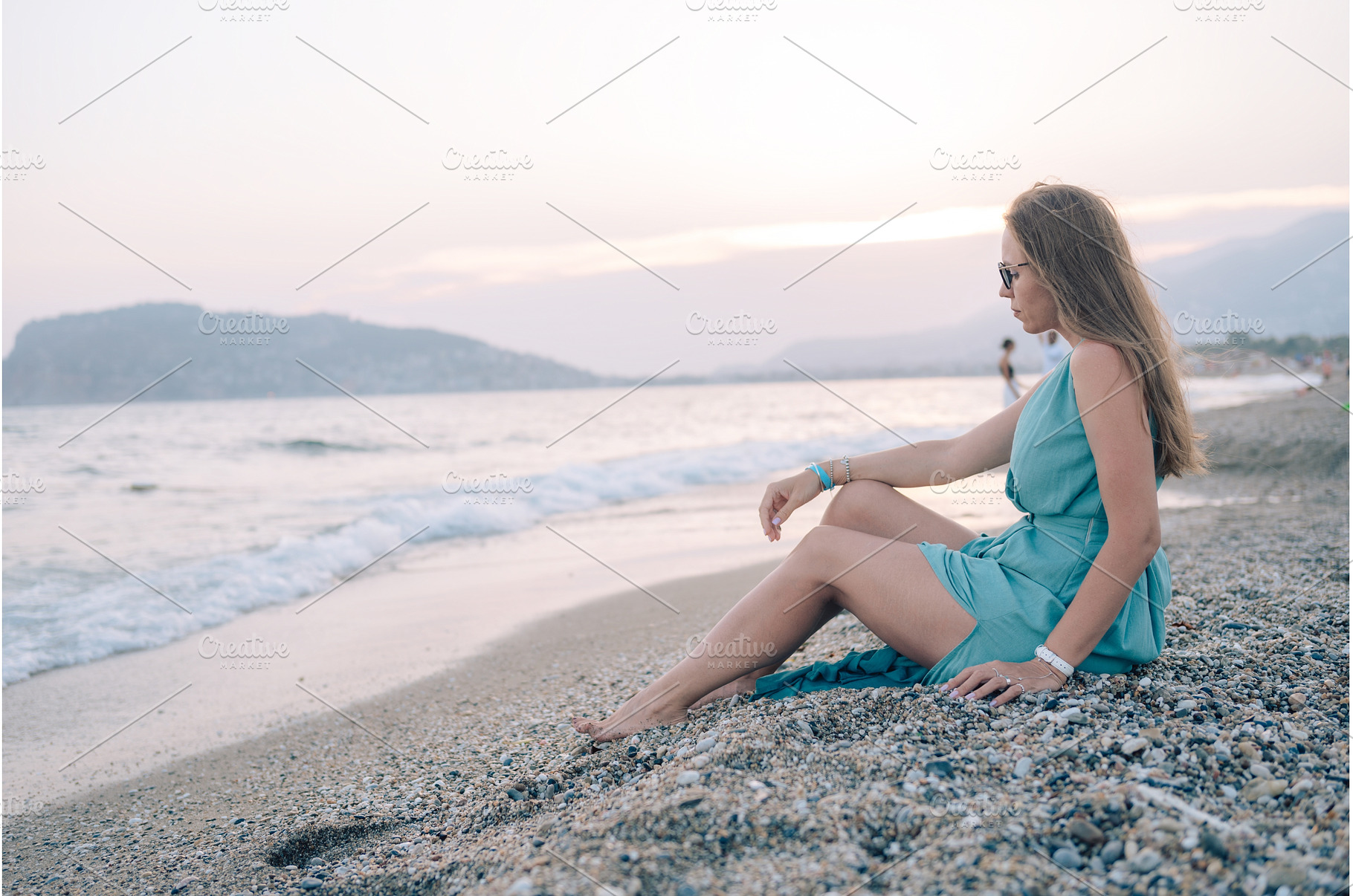 Woman in Flowing Dress on Seaside, a Person Photo by Jan Jack Russo Media