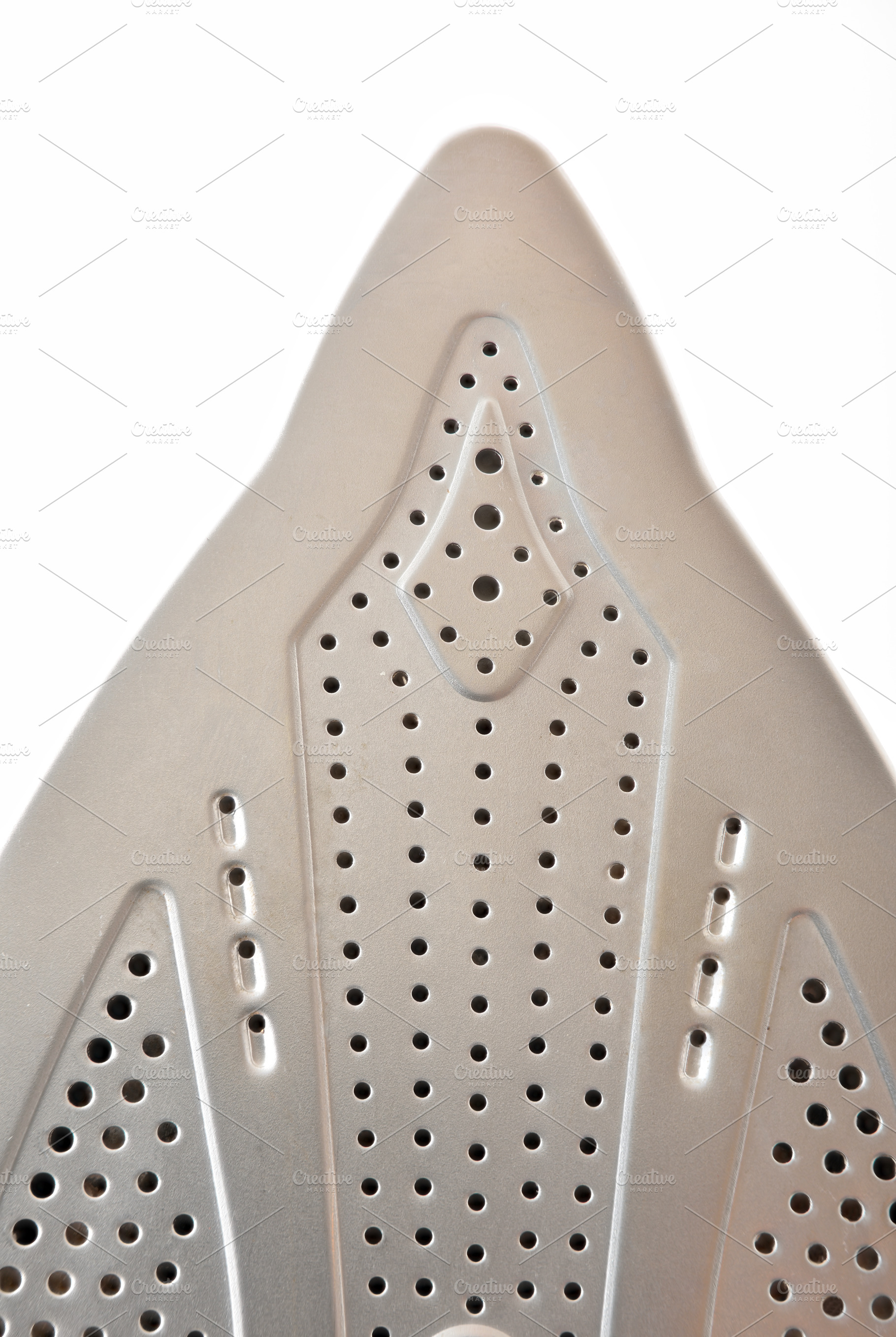 Detail of tip of metal soleplate of a steam iron, a Technology Photo by Davizro's Market