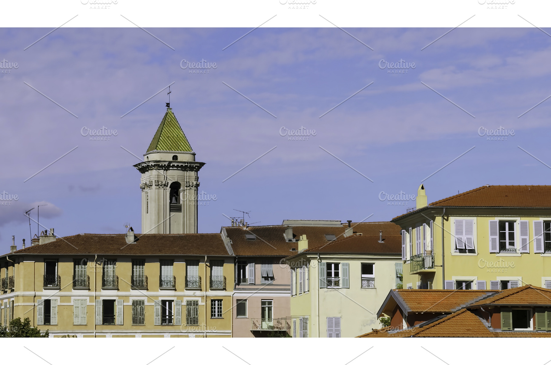 Colorful buildings and church tower, an Architecture Photo by Media Whale Stock