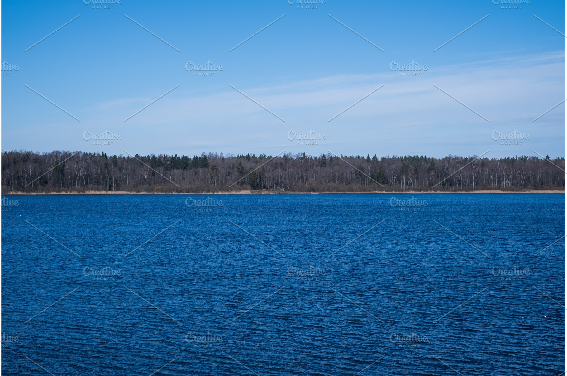 Blue sky over river on spring, a Nature Photo by Koldunova