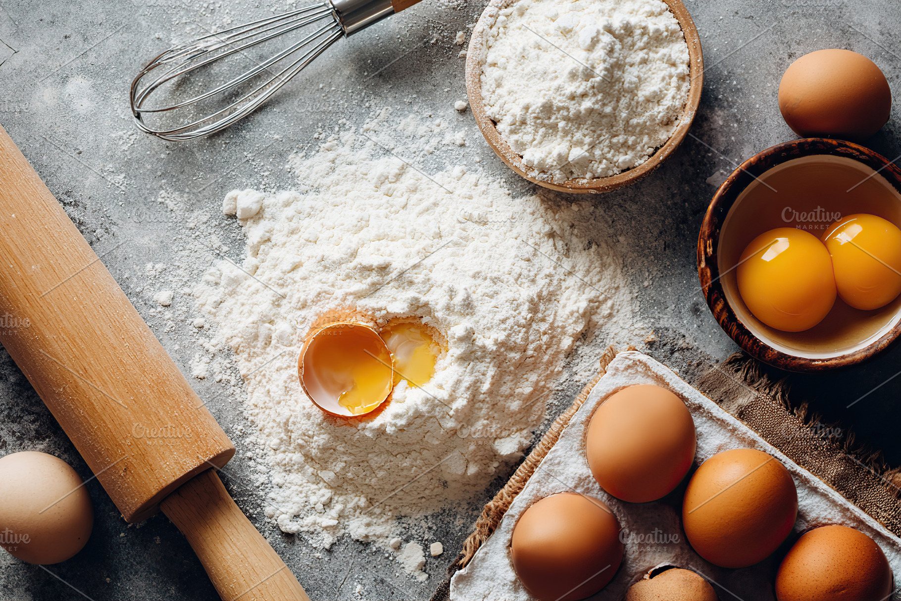Baking ingredients spread out on a rustic table for homemade treats, a Food & Drink Photo by AlyaAnd
