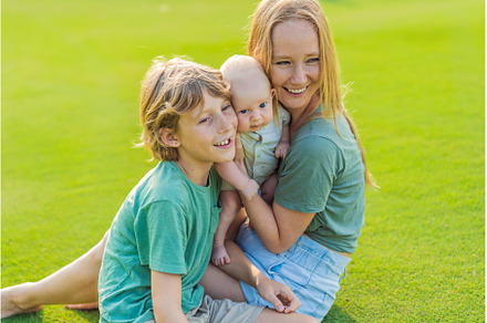 Mother, older son, and newborn baby