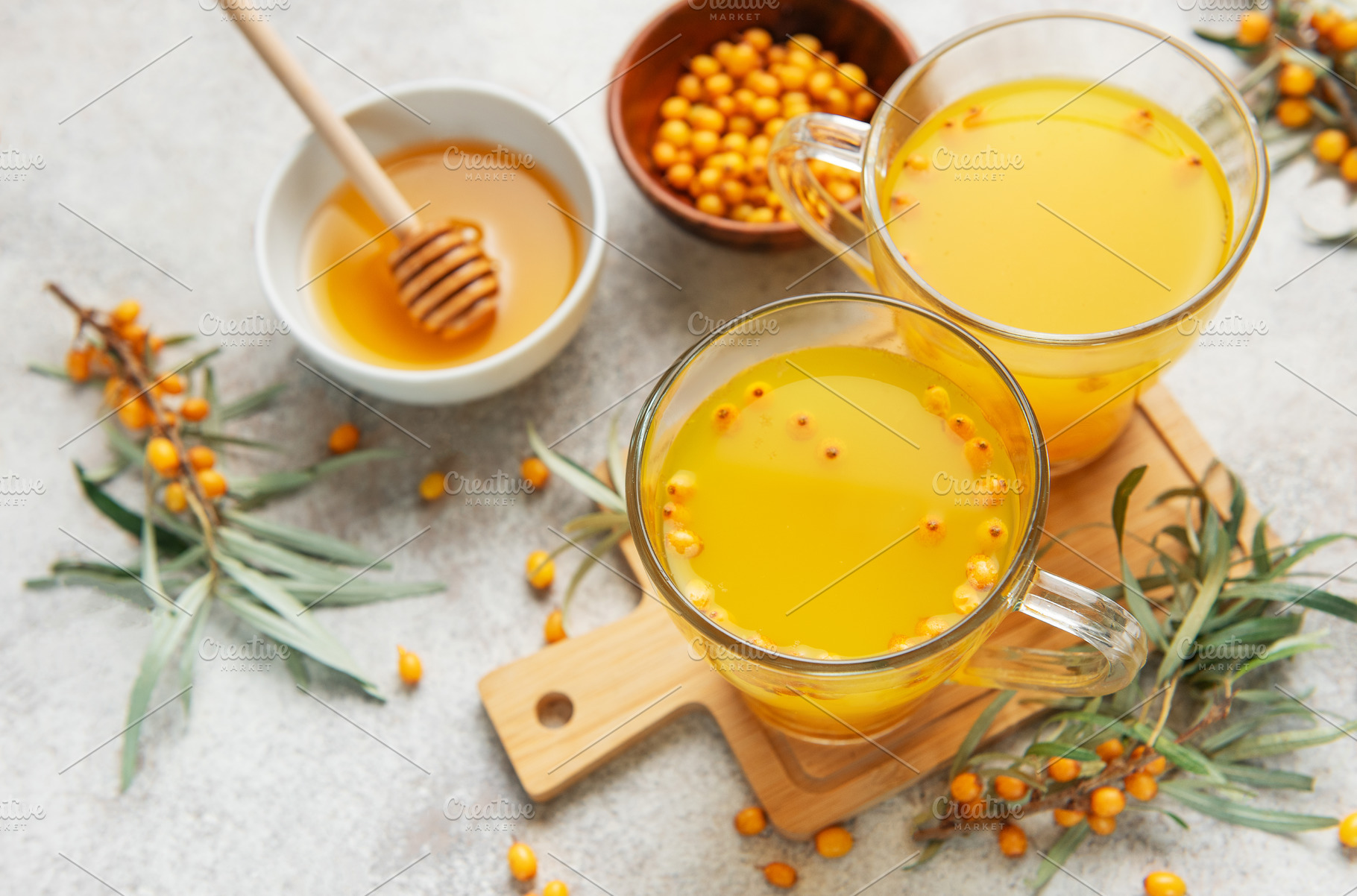 Sea buckthorn hot drink with honey promoting wellness, a Food & Drink Photo by Olena Rudo