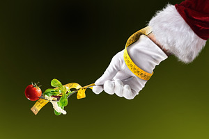 Christmas diet with Santa's holding fork salad and measuring tap, a Holiday Photo by Davizro's Market
