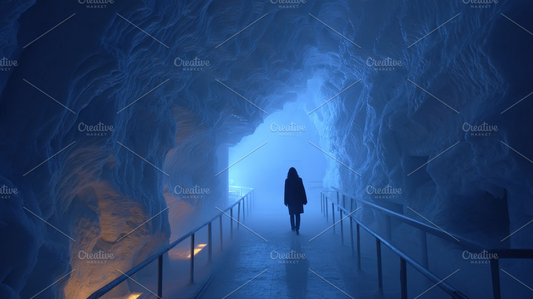 Woman walking through a blue ice cav, a Photo by Pixeness Studio