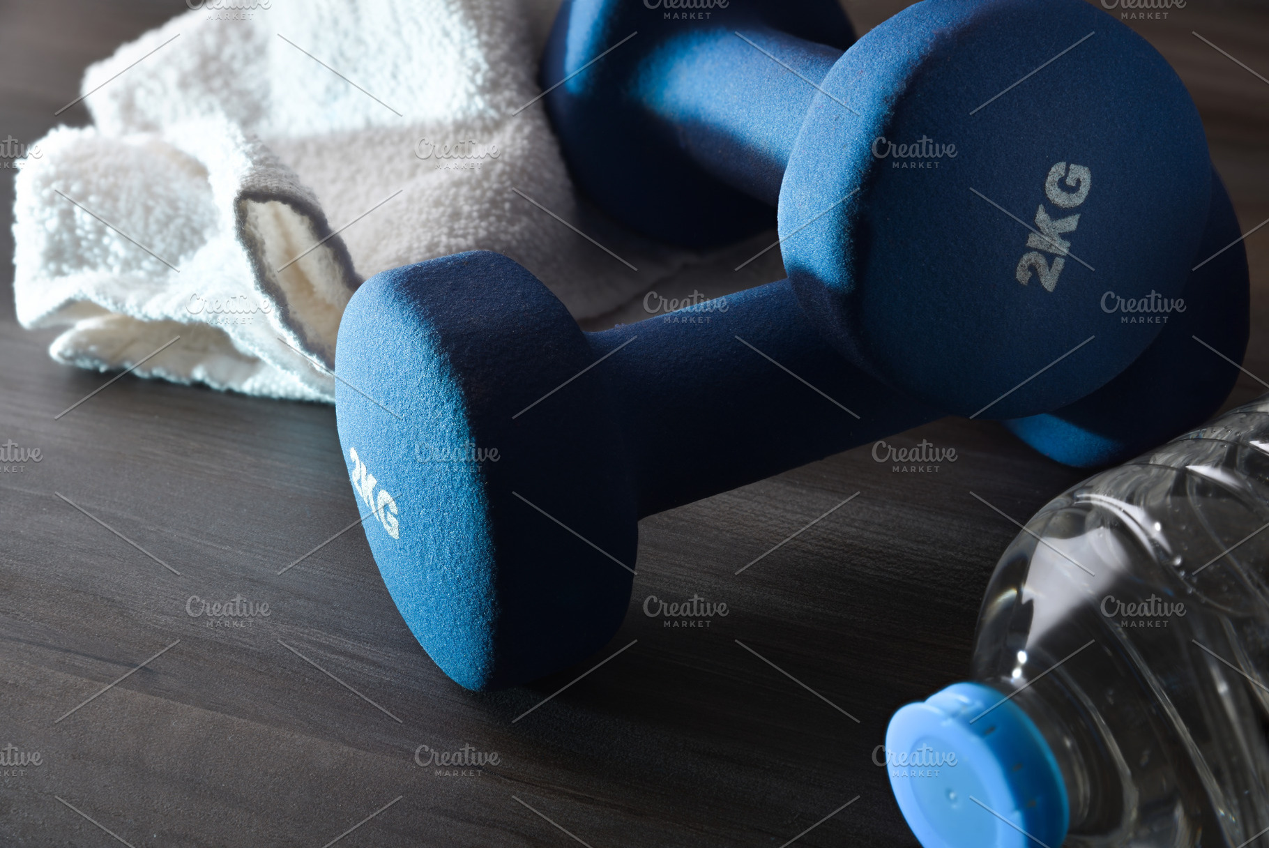 Sport training and wellness with dumbbells water and towel dark, a Sports & Recreation Photo by Davizro's Market