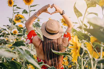 Girl in a field of sunflowers