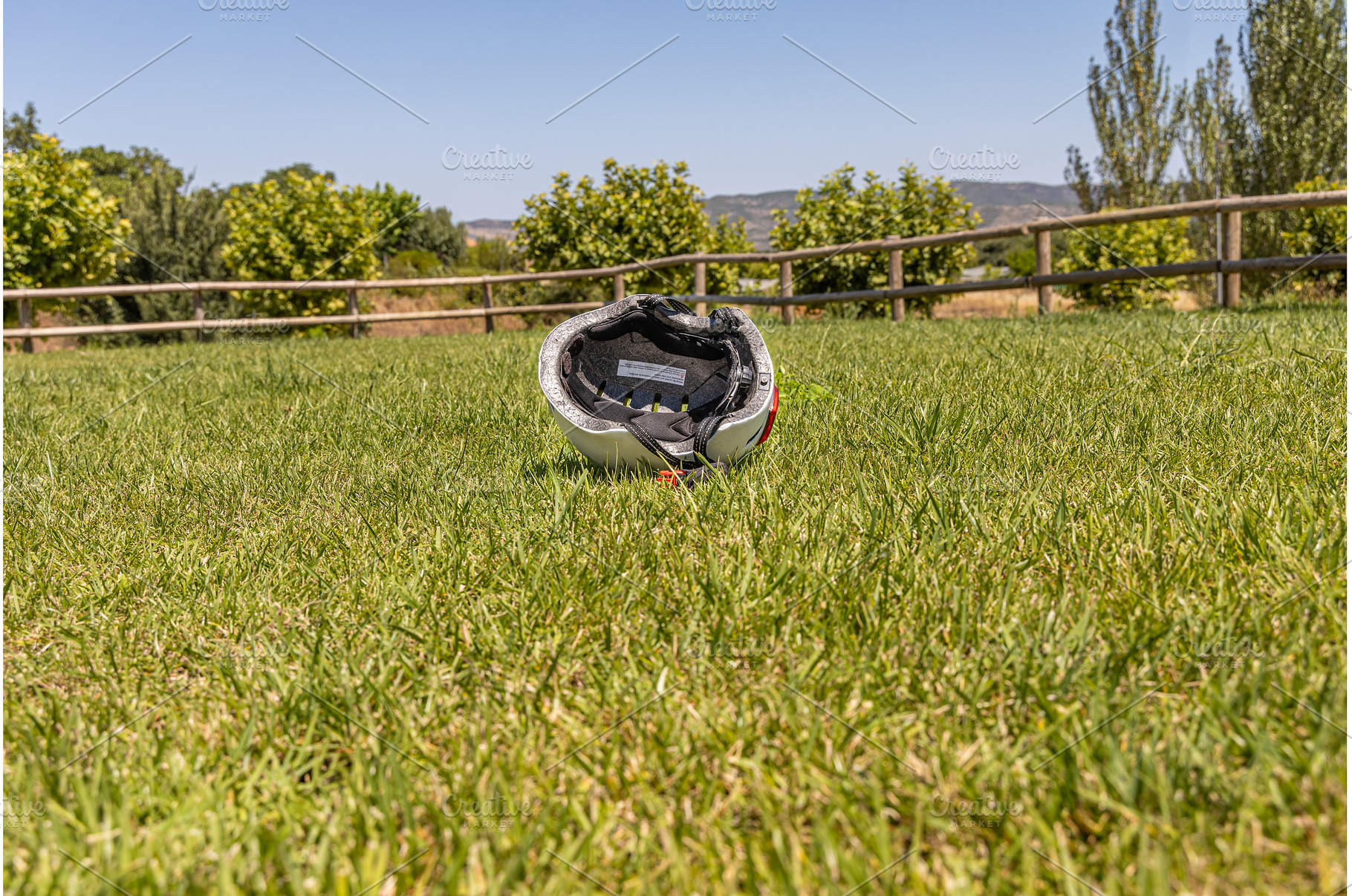 A white helmet on the green grass, a Technology Photo by Illustrations&photos