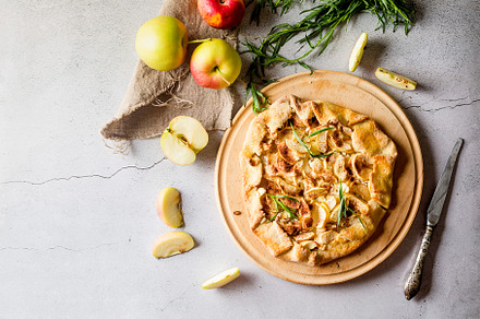 Homemade apple and cinnamon galette on old concrete  background., a Food & Drink Photo by vimart