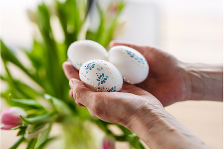 Hands holding decorated Easter eggs, a Holiday Photo by HalfPoint