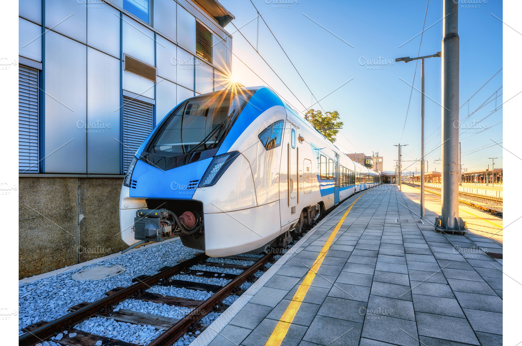 High-speed blue passenger train at, a Transportation Photo by den-belitsky
