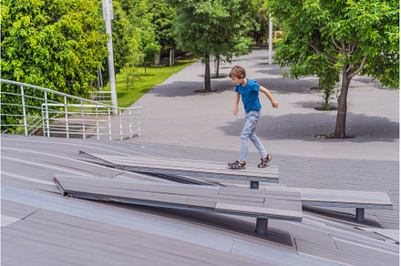 Teenage boy doing parkour in a park, a Sports & Recreation Photo by Elizaveta Galitskaya