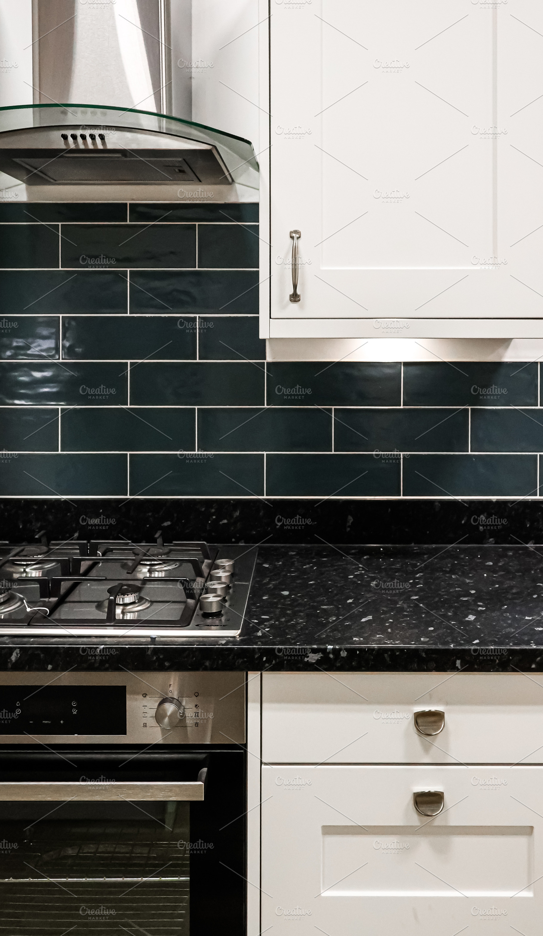 Modern kitchen interior, dark green subway tile, black granite countertop, whit, a Photo by Studio ANNA